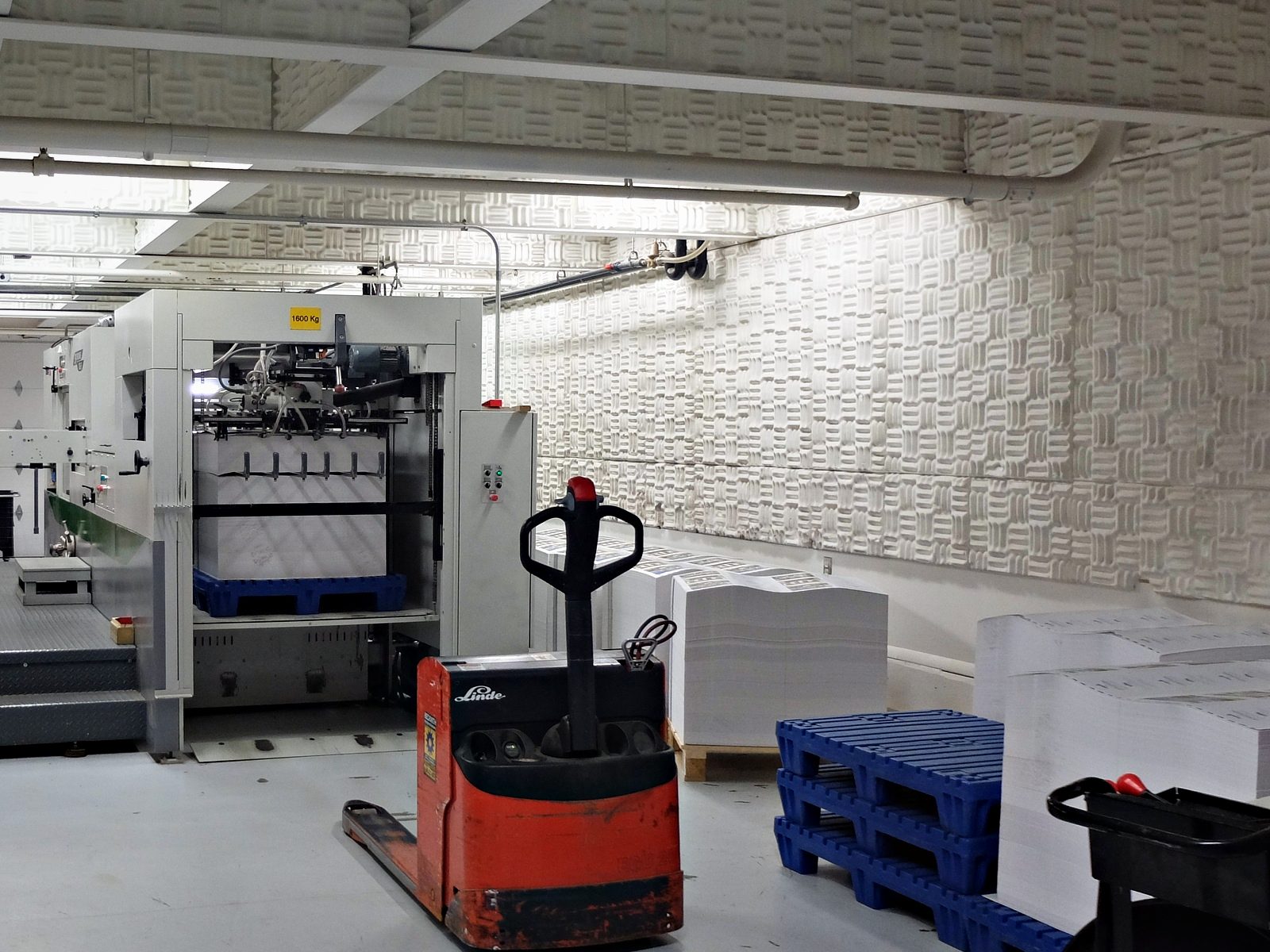 The bindery floor at Broudy Printing, with the stitching line and finished work stacked ready to move
