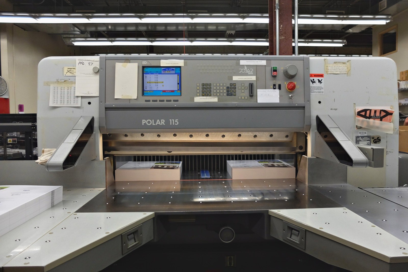 A Polar 115 programmable guillotine in the bindery at Broudy Printing