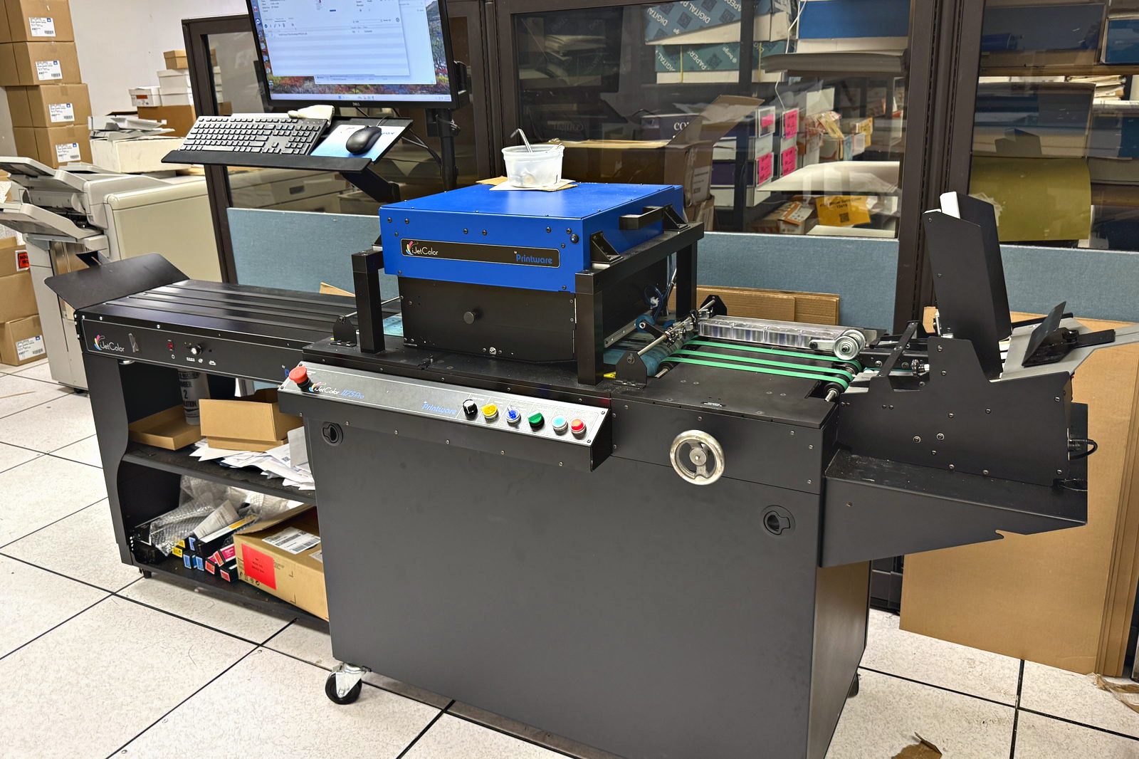 The iJetColor 1175 Pro envelope press and its conveyor at Broudy Printing