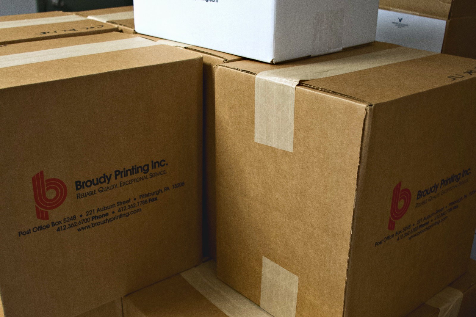 Cartons printed with the Broudy Printing mark, packed and ready to ship